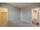 Bedroom with doors to bathroom and closet, plus neutral paint and carpeted floor at 3721 W Aracely Dr, New River, AZ 85087