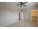 Carpeted bedroom featuring doors to closet and hallway plus ceiling fan at 3721 W Aracely Dr, New River, AZ 85087