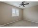 Bedroom with carpeted floor, ceiling fan, window with shutters, and neutral paint at 3721 W Aracely Dr, New River, AZ 85087