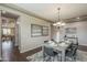 Well-lit dining room with modern furnishings, a rustic table, and sophisticated wall art at 3721 W Aracely Dr, New River, AZ 85087