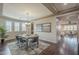 Modern dining room with plenty of natural light and view to living space at 3721 W Aracely Dr, New River, AZ 85087