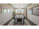 Bright dining room featuring wood floors, neutral walls, and a stylish chandelier at 3721 W Aracely Dr, New River, AZ 85087