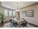Modern dining room with plenty of natural light and view to living space at 3721 W Aracely Dr, New River, AZ 85087