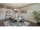 Charming dining area with a rustic wood table, modern chairs, and stylish decorations at 3721 W Aracely Dr, New River, AZ 85087