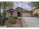 Inviting single-story home featuring a stone facade, low maintenance desert landscaping, and a spacious two-car garage at 3721 W Aracely Dr, New River, AZ 85087