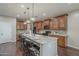 Kitchen island with granite countertops and seating space for dining at 3721 W Aracely Dr, New River, AZ 85087