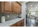 Open concept kitchen with spacious counters, sleek appliances, and dark wood floors at 3721 W Aracely Dr, New River, AZ 85087