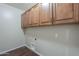Laundry room features upper cabinets and hookups for appliances at 3721 W Aracely Dr, New River, AZ 85087