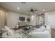 Modern living room with a TV, hardwood floors, stylish furniture, and an open layout at 3721 W Aracely Dr, New River, AZ 85087