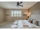 Bright, stylish bedroom with plush carpeting, ceiling fan, and a comfortable bed at 3721 W Aracely Dr, New River, AZ 85087