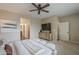 Spacious bedroom featuring a ceiling fan, neutral decor, and access to the ensuite bathroom at 3721 W Aracely Dr, New River, AZ 85087