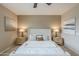 Well-decorated bedroom with modern lighting, comfortable bed, and neutral color palette at 3721 W Aracely Dr, New River, AZ 85087