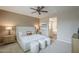 Serene bedroom featuring a cozy bed, soft lighting, and an ensuite bathroom at 3721 W Aracely Dr, New River, AZ 85087