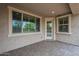 Covered patio with large windows and a door, providing outdoor access and natural light at 3721 W Aracely Dr, New River, AZ 85087