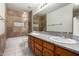 Bathroom featuring a double sink vanity, tiled shower and neutral color palette at 3740 W Kent Dr, Chandler, AZ 85226
