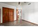Bedroom featuring a closet with wood doors and adjacent to the kitchen at 3740 W Kent Dr, Chandler, AZ 85226