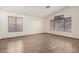 Sun-filled bedroom featuring tile floors and dual windows at 3740 W Kent Dr, Chandler, AZ 85226