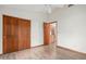 Bedroom featuring a closet with wood doors and adjacent to the kitchen at 3740 W Kent Dr, Chandler, AZ 85226