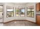 Cozy breakfast nook with a chandelier and large windows overlooking the landscaped backyard at 3740 W Kent Dr, Chandler, AZ 85226