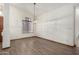 Open dining area features tile flooring, natural light, and chandelier at 3740 W Kent Dr, Chandler, AZ 85226
