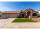 Beautiful single-story home showcasing desert landscaping, manicured lawn, and a spacious three-car garage at 3740 W Kent Dr, Chandler, AZ 85226