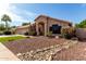 Beautiful home exterior with a well-maintained lawn, desert landscape, and charming curb appeal in a desirable community at 3740 W Kent Dr, Chandler, AZ 85226