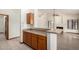 View of the kitchen and breakfast bar, with access to another room at 3740 W Kent Dr, Chandler, AZ 85226
