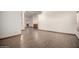 View of the spacious living room featuring wood-look tile floors and lots of natural light at 3740 W Kent Dr, Chandler, AZ 85226