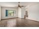 Spacious main bedroom with a ceiling fan and a view to the bathroom and an exterior window at 3740 W Kent Dr, Chandler, AZ 85226