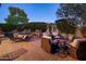 Relaxing backyard with pool, fire pit, and lounge chairs, an ideal retreat at 3741 E Ember Glow Way, Phoenix, AZ 85050