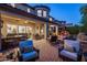 Expansive outdoor living area including a bar, multiple seating areas, and water features at 3741 E Ember Glow Way, Phoenix, AZ 85050