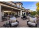 Expansive backyard features a patio, fire pit, outdoor seating, pool, spa, and lush landscaping at 3741 E Ember Glow Way, Phoenix, AZ 85050