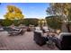 Resort style backyard featuring a sparkling pool, spa, firepit, lounge chairs and mature landscaping at 3741 E Ember Glow Way, Phoenix, AZ 85050