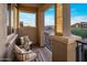 Relaxing balcony with seating area, views of the neighborhood, and a tranquil atmosphere at 3741 E Ember Glow Way, Phoenix, AZ 85050
