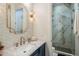 This bathroom features an elegant combination of gold and marble with a glass enclosed walk in shower at 3741 E Ember Glow Way, Phoenix, AZ 85050
