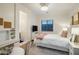 Cozy bedroom features neutral decor, a plush rug, and a workspace with modern desk and chair set at 3741 E Ember Glow Way, Phoenix, AZ 85050