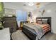Comfortable bedroom with wood accent wall, and natural light at 3741 E Ember Glow Way, Phoenix, AZ 85050