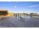 Resort-style community pool with lounge chairs, cabanas, and beautiful landscaping in a serene setting at 3741 E Ember Glow Way, Phoenix, AZ 85050