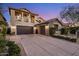 Stunning two-story home featuring a three-car garage and landscaped front yard at 3741 E Ember Glow Way, Phoenix, AZ 85050
