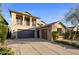 Stunning two-story home featuring a three-car garage and manicured landscaping at 3741 E Ember Glow Way, Phoenix, AZ 85050