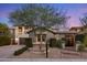 Charming front yard showcasing desert landscaping and a beautiful tree at 3741 E Ember Glow Way, Phoenix, AZ 85050