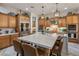Elegant kitchen features stainless steel appliances, custom cabinetry, and oversized island at 3741 E Ember Glow Way, Phoenix, AZ 85050