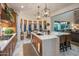 Bright kitchen with central island and view to breakfast nook and Gathering room at 3741 E Ember Glow Way, Phoenix, AZ 85050