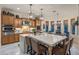 Gourmet kitchen featuring a large center island with seating and modern appliances at 3741 E Ember Glow Way, Phoenix, AZ 85050