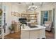 Well-lit home office featuring custom built-ins, a modern desk, and elegant decor at 3741 E Ember Glow Way, Phoenix, AZ 85050
