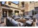 Stylish outdoor patio with comfortable wicker furniture and elegant stone accents at 3741 E Ember Glow Way, Phoenix, AZ 85050