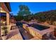 Beautiful pool and spa, enhanced by mature plants, offer a private backyard retreat at 3741 E Ember Glow Way, Phoenix, AZ 85050