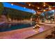 Luxury pool area with a built-in bar under a pergola, and privacy landscaping at 3741 E Ember Glow Way, Phoenix, AZ 85050