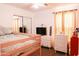 Cozy bedroom with a daybed, dresser, and large mirror sliding closet at 3756 E Alamo St, San Tan Valley, AZ 85140