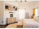 Bright bedroom featuring wood floors, white walls, modern art, and two matching nightstands at 3756 E Alamo St, San Tan Valley, AZ 85140